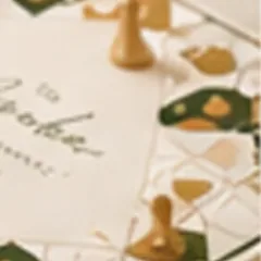 A personalised Ludo board with gold playing pieces